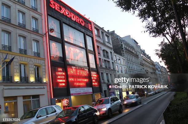 Photography taken on July 11, 2013 shows a sexshop at the Pigalle district in Paris. AFP PHOTO / PATRICK KOVARIK