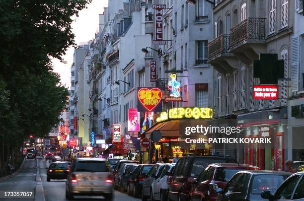 Photography taken on July 11, 2013 shows the Rochechouart boulevard at the Pigalle district in Paris. AFP PHOTO / PATRICK KOVARIK
