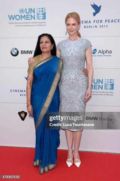 Lakshmi Puri and Nicole Kidman arrive for the Cinema for Peace UN women honorary dinner at Soho House on July 12, 2013 in Berlin, Germany.