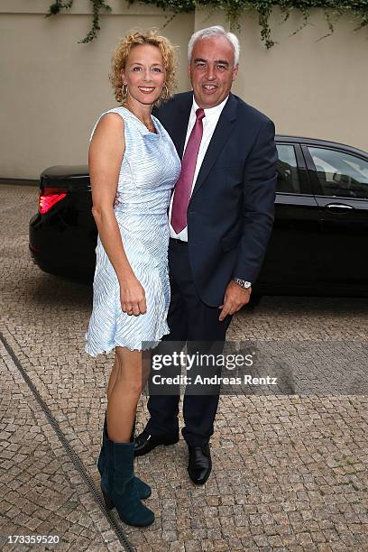 Katja Riemann and Hans-Rainer Schroeder arrive for the Cinema for Peace UN women honorary dinner at Soho House on July 12, 2013 in Berlin, Germany.