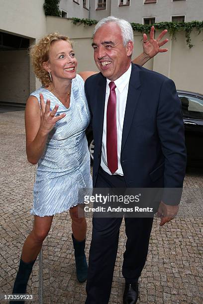 Katja Riemann and Hans-Rainer Schroeder arrive for the Cinema for Peace UN women honorary dinner at Soho House on July 12, 2013 in Berlin, Germany.
