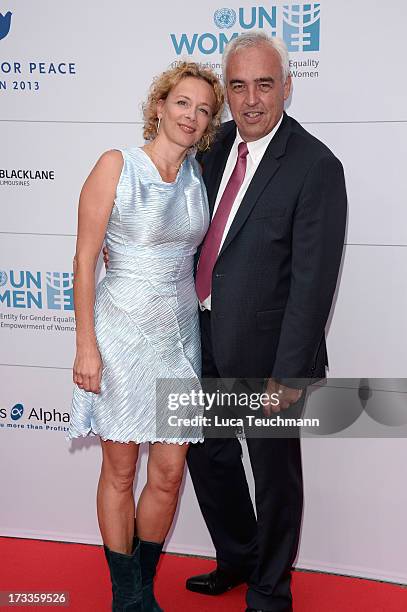 Katja Riemann and Hans-Rainer Schroeder arrive for the Cinema for Peace UN women honorary dinner at Soho House on July 12, 2013 in Berlin, Germany.