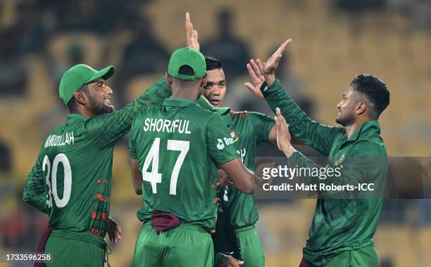 Shakib Al Hasan of Bangladesh celebrates the wicket of Devon Conway of New Zealand during the ICC Men's Cricket World Cup India 2023 between New...