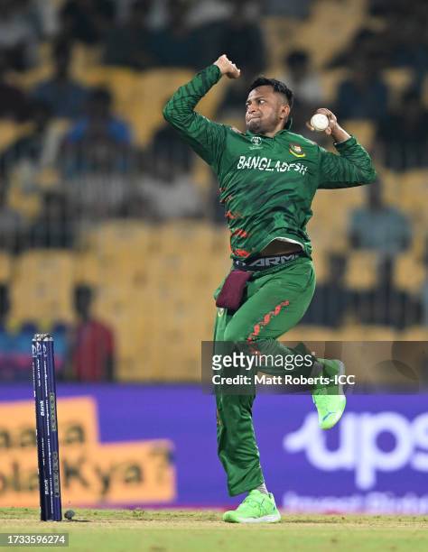 Shakib Al Hasan of Bangladesh in bowling action during the ICC Men's Cricket World Cup India 2023 between New Zealand and Bangladesh at MA...