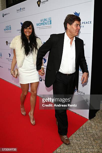 Raffaela Slyusareva and Jack White arrive for the Cinema for Peace UN women honorary dinner at Soho House on July 12, 2013 in Berlin, Germany.