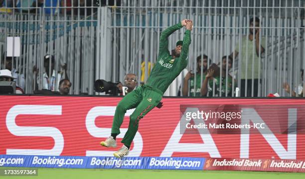Mahmudullah of Bangladesh attempts to catch Daryl Mitchell of New Zealand during the ICC Men's Cricket World Cup India 2023 between New Zealand and...