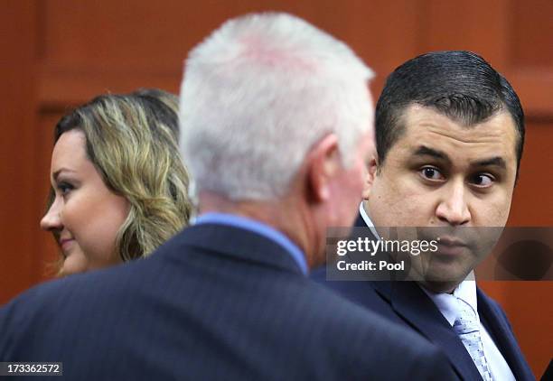 George Zimmerman , Seminole court services investigator Rob Hemmert and George Zimmerman's wife Shellie Zimmerman , stand in the courtroom during...