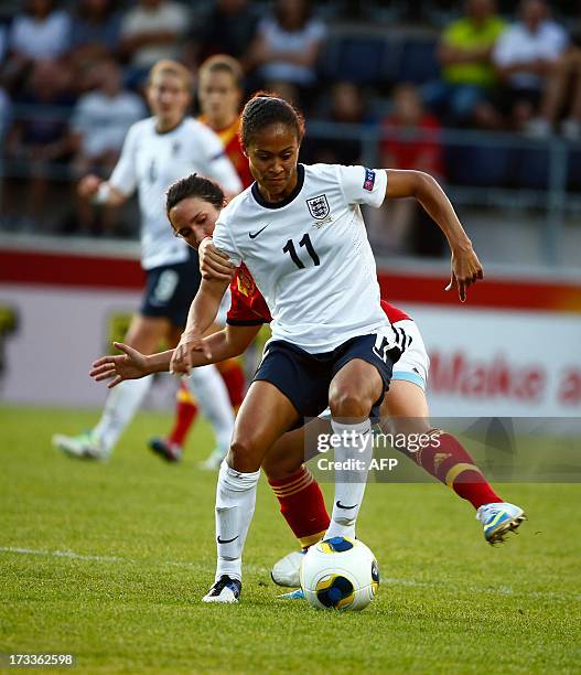 England's Rachel Yankey fights for the ball with Spain's Silvia Meseguer during the UEFA Women's EURO 2013 group C soccer match between England and...