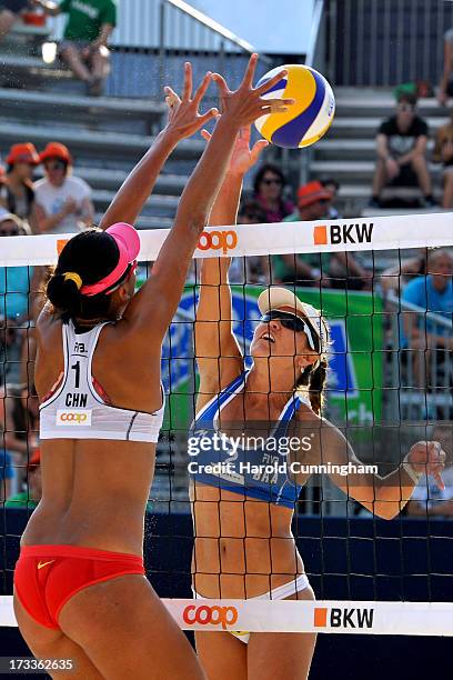 China's Chen Xue defends the ball as Brazils' Maria Antonelli attacks on during the Antonelli-Agatha v Xue-Zhang Xi game as part of the FIVB Gstaad...