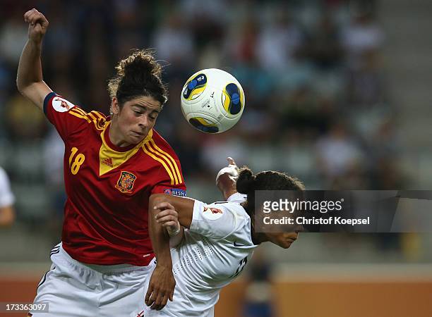 Marta Torrejon of Spain and Rachel Yankey of England go up for a header during the UEFA Women's EURO 2013 Group C match between England and Spain at...