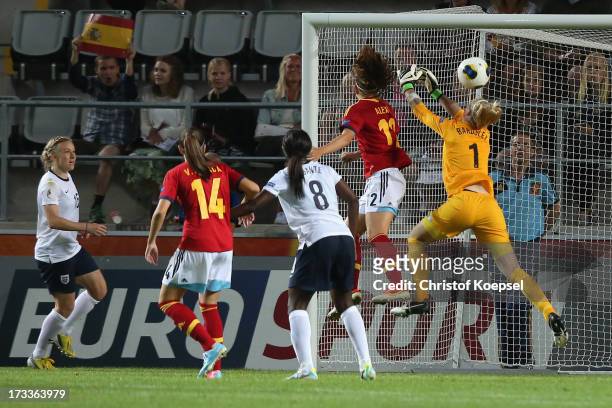 Alexia Putellas of Spain scores the third and decision goal against Karen Bardsley of England during the UEFA Women's EURO 2013 Group C match between...