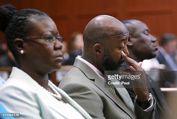 Trayvon Martin's parents, Sybrina Fulton and Tracy Martin , watch the prosecution's rebuttal closing argument during George Zimmerman's murder trial...