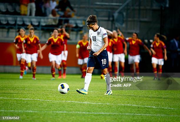 England's Fara Williams looks dejected as Spanish players celebrate their second goal during the UEFA Women's EURO 2013 group C soccer match between...