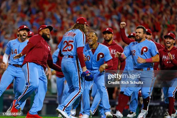 Relief pitcher Matt Strahm of the Philadelphia Phillies celebrates with teammates after beating the Atlanta Braves 3-1 in Game Four of the Division...