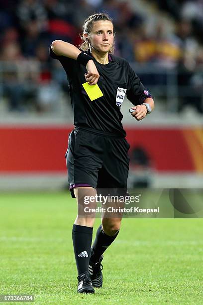Referee Kateryna Monzul of Ukraine shows a yellow card during the UEFA Women's EURO 2013 Group C match between England and Spain at Linkoping Arena...