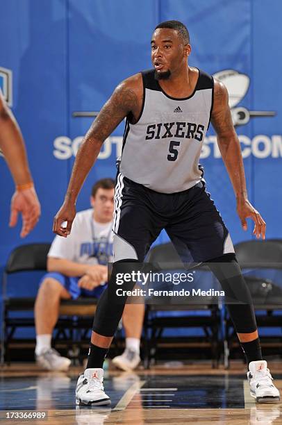 Arnett Moultrie of the Philadelphia 76ers defends against the Brooklyn Nets during the 2013 Southwest Airlines Orlando Pro Summer League on July 12,...