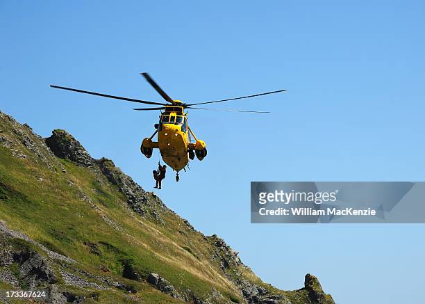 Young couple and their dog became trapped by the quickly rising tide and had to be flown to safety by a Royal Air Force search and rescue team.