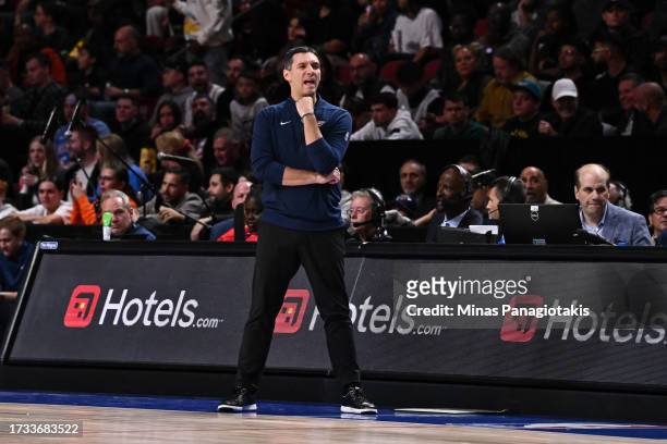 Head coach of the Oklahoma City Thunder, Mark Daigneault, handles bench duties during the first half of a preseason NBA game against the Detroit...