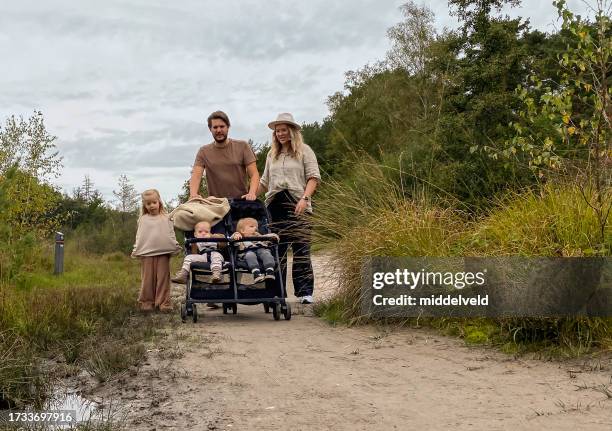 young family having a holiday walk in the heath - huis ter heide stockfoto's en -beelden