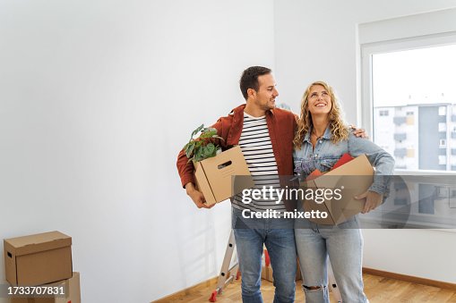 Young couple in their new home Young couple in their new home