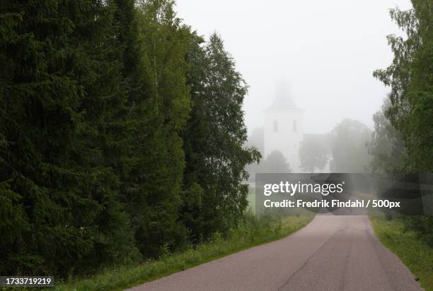 view of trees and church against sky - landskap fotografías e imágenes de stock