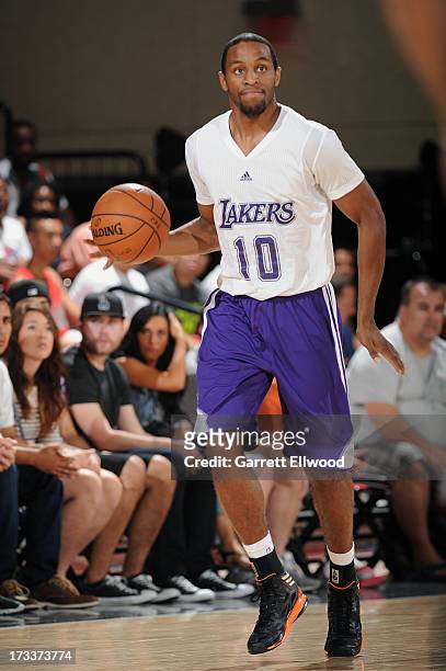 Michael Snaer of the Los Angeles Lakers controls the ball against the Cleveland Cavaliers during NBA Summer League on July 12, 2013 at the Cox...