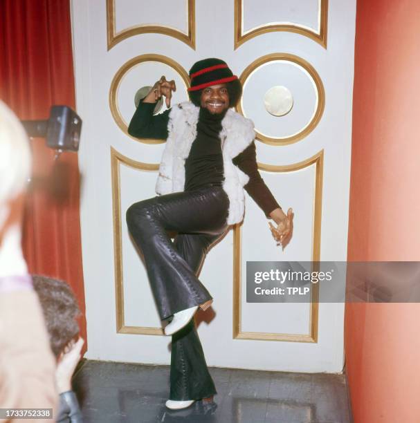 Portrait of American Rock & R&B musician Billy Preston as he poses, balancing on one leg, London, England, January 28, 1972.