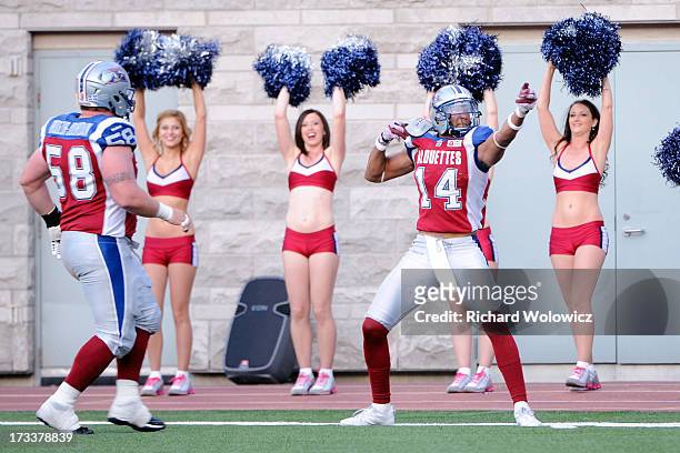 Brandon London of the Montreal Alouettes celebrates his first half touchdown during the CFL game against the Calgary Stampeders at Percival Molson...