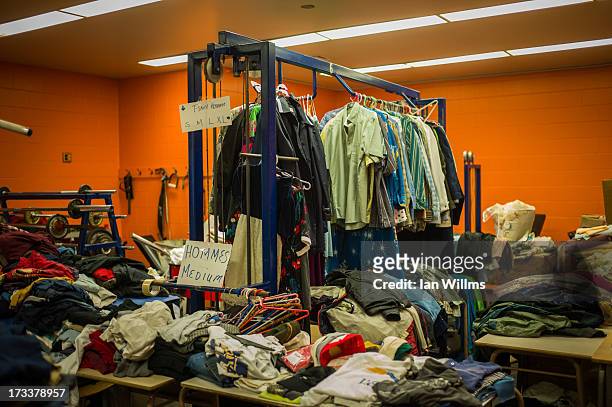 Clothing donations are shown at a Red Cross disaster relief centre set up at a secondary school July 12, 2013 in Lac-Megantic, Quebec, Canada. A...
