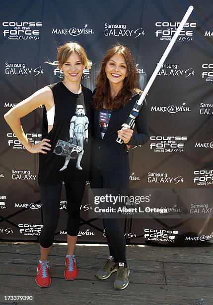 Actress Danielle Panabaker and actress Aimee Teegarden participate in the 2013 The Course Of The Force lightsaber Relay to Benefit The Make-A-Wish...