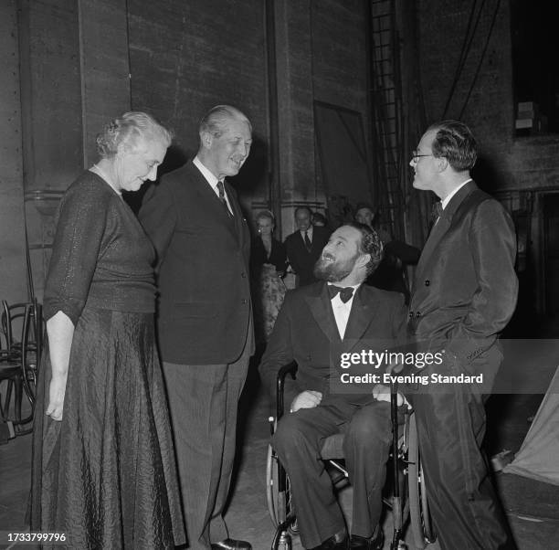 Prime Minister Harold Macmillan and his wife, Lady Dorothy Macmillan speak with entertainers Michael Flanders and Donald Swann June 11th 1958.