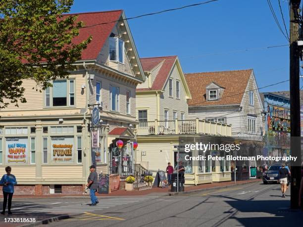 busy shops and tourists in old town provincetown, cape cod, massachusetts - provincetown stock pictures, royalty-free photos & images