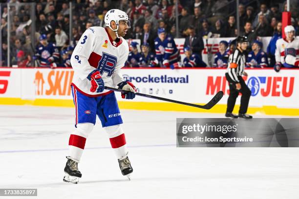 Laval Rocket defenseman Jayden Struble tracks the play during the game between the Rochester Americans versus the Laval Rocket on October 18, 2023 at...