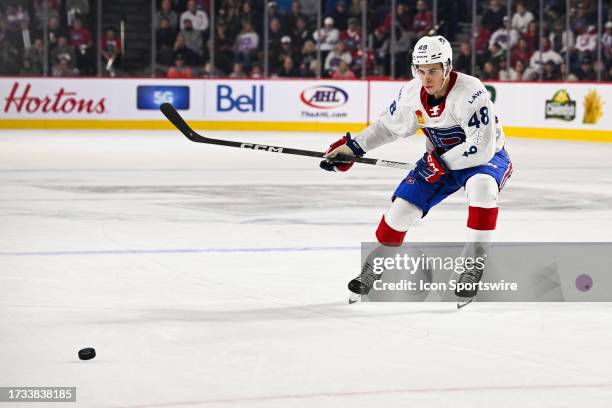 Laval Rocket right wing Filip Mesar plays the puck during the game between the Rochester Americans versus the Laval Rocket on October 18, 2023 at...