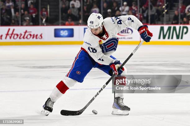 Laval Rocket right wing Filip Mesar plays the puck during the game between the Rochester Americans versus the Laval Rocket on October 18, 2023 at...