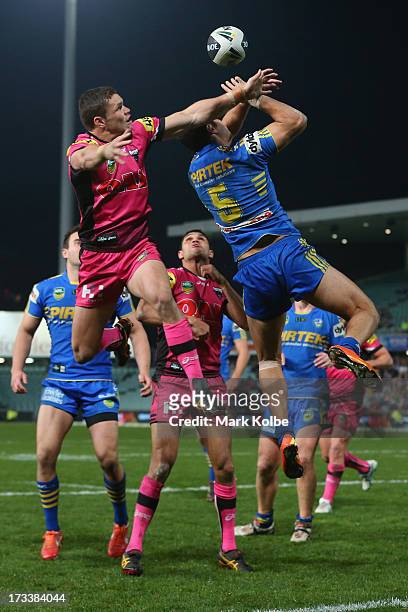 James Roberts of the Panthers and Brayden Wiliame of the Eels compete for the ball from a kick during the round 18 NRL match between Parramatta Eels...