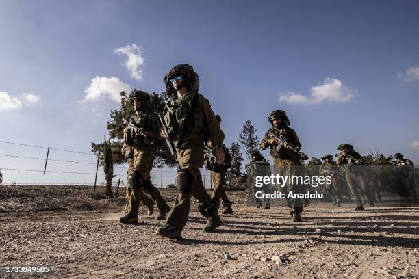 Israeli soldiers patrol near the Gaza border as the clash between Israeli army and Palestinian factions continues in Nir Oz, Israel on October 19,...