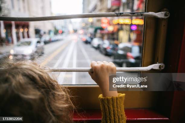 girl riding cable car in san francisco - trolley bus stock pictures, royalty-free photos & images