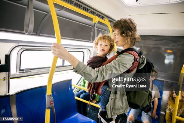 family riding public transportation in san francisco - área da baía de san francisco imagens e fotografias de stock