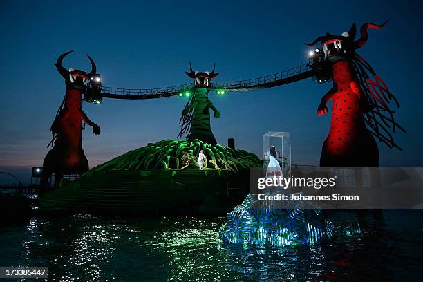 Opera singers Rainer Trost and Gisela Stille perform on the floating stage during the rehearsal of the opera 'Die Zauberfloete' of Austrian composer...