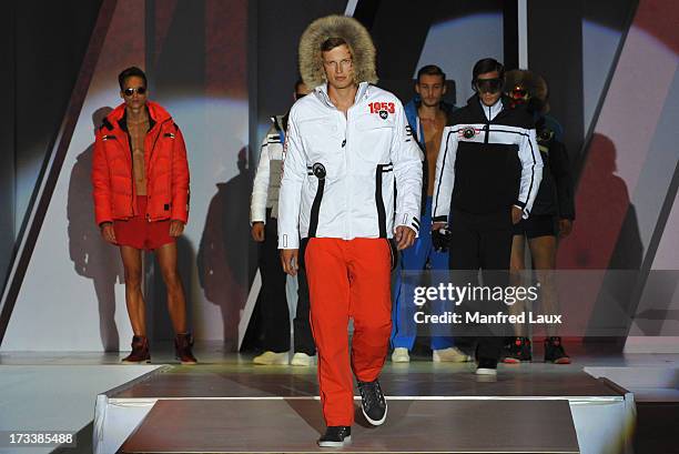 Models walk the runway during a Sportalm fashion show held during their 60th anniversary celebration at Bichelalm on July 12, 2013 in Kitzbuehel,...