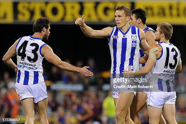 Drew Petrie of the Kangaroos celebrates a goal during the round 16 AFL match between the Brisbane Lions and the North Melbourne Kangaroos at The...