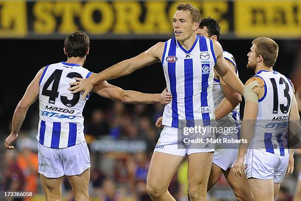 Drew Petrie of the Kangaroos celebrates a goal during the round 16 AFL match between the Brisbane Lions and the North Melbourne Kangaroos at The...