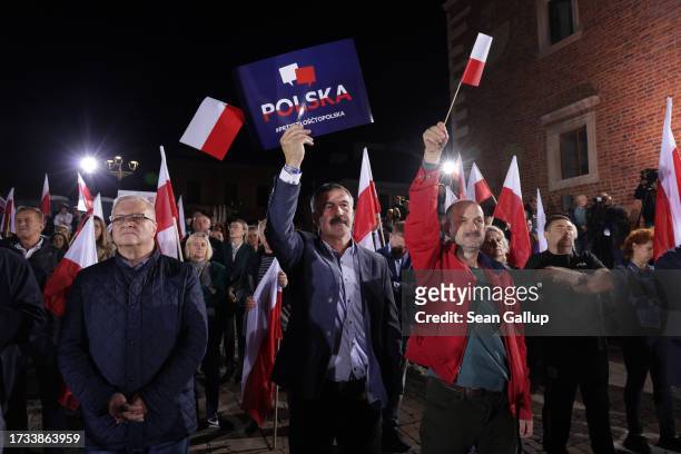 Supporters of the ruling national conservative Law and Justice party attend the final PiS election rally before parliamentary elections scheduled for...