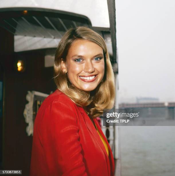 Portrait of Welsh television host and journalist Anneka Rice as she poses on a boat, London, England, September 29, 1983.