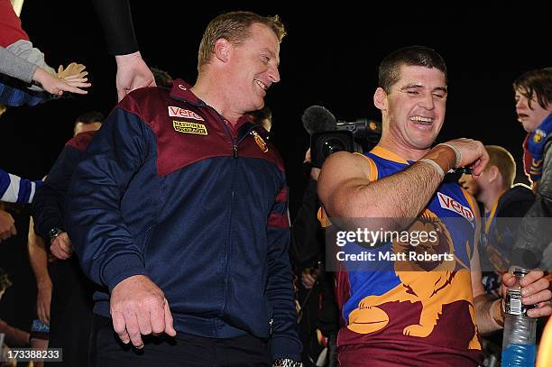 Lions coach Michael Voss and Jonathan Brown of the Lions celebrate after the round 16 AFL match between the Brisbane Lions and the North Melbourne...