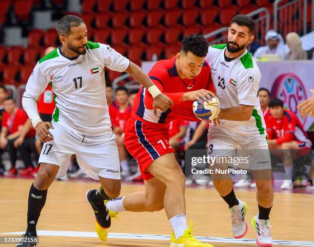 Saood Raj Jianjie of China and Saood Sulaiman Mohamed of United Arab Emirates ...