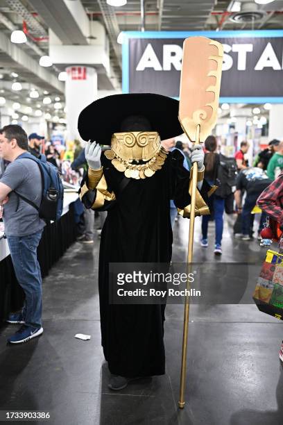 Cosplayer posing as Charon from Hades attends New York Comic Con 2023 - Day 2 at Javits Center on October 13, 2023 in New York City.