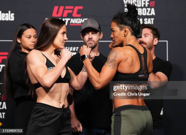 Opponents Jennifer Maia of Brazil and Viviane Araujo of Brazil face off during the UFC Fight Night weigh-in at UFC APEX on October 13, 2023 in Las...