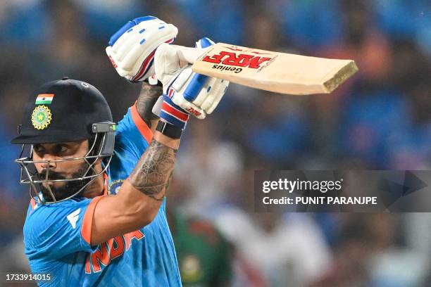 India's Virat Kohli watches the ball after playing a shot during the 2023 ICC Men's Cricket World Cup one-day international match between India and...